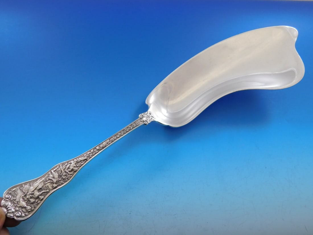 Tiffany & Co Olympian Sterling Silver Dolphin Crumber 12.5 inches: Tiffany & Co Olympian Sterling Silver Dolphin Crumber 12.5 inches This exquisite crumber from the Olympian pattern by Tiffany & Co. features a unique dolphin shape, measuring 12 1/2 inches. Crafted fr