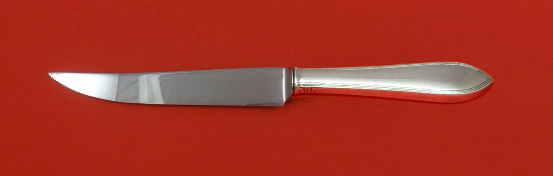 Tiffany & Co Reeded Edge Sterling Silver Steak Knife 8 1/2 Custom Made: Tiffany & Co Reeded Edge Sterling Silver Steak Knife 8 1/2 Custom Made Discover the elegance of the Reeded Edge Steak Knife by Tiffany & Co., expertly crafted from sterling silver. This custom-made st