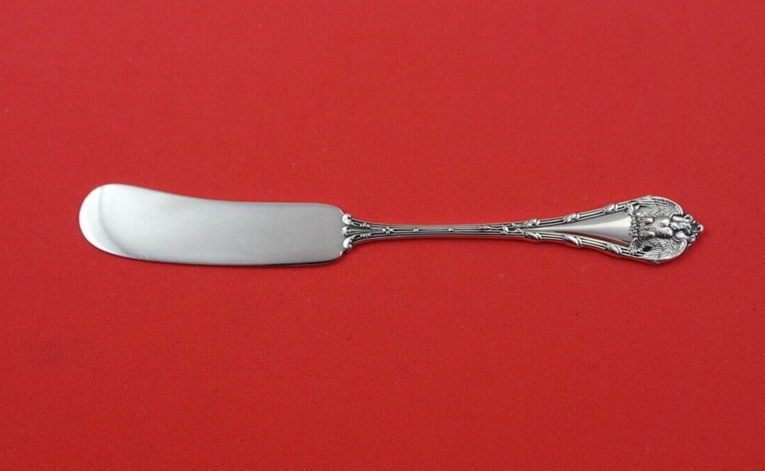 Durgin National Sterling Silver Butter Spreader Flat Handle 5 1/4": Durgin National Sterling Silver Butter Spreader Flat Handle 5 1/4" This exquisite butter spreader features a flat handle design, crafted from high-quality sterling silver in the National pattern by Du