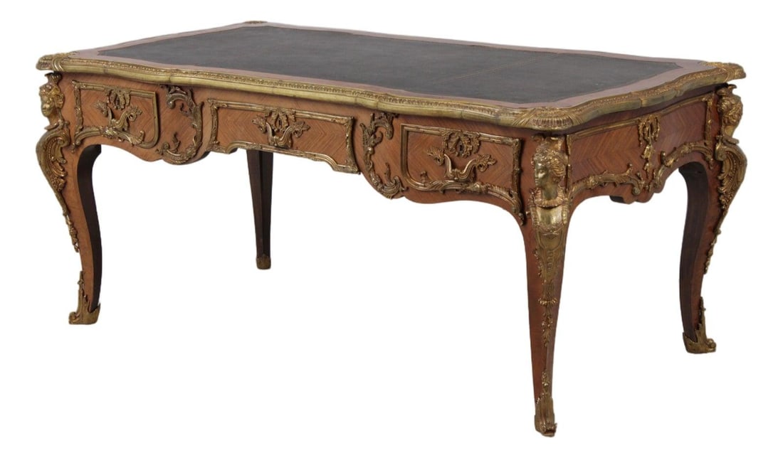 French Mahogany Bureau Plat Desk with Tooled Leather and Ormolu Accents: French Mahogany Bureau Plat Desk with Tooled Leather and Ormolu Accents This vintage Louis XV style bureau plat writing desk features a mahogany construction with solid brass hardware, brass capped fe