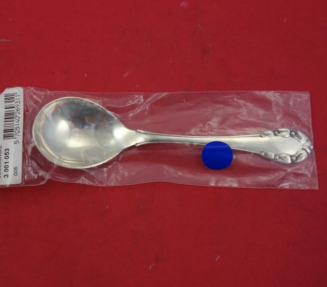 Georg Jensen Lily of the Valley Sterling Silver Bouillon Spoon 5 3/4": Georg Jensen Lily of the Valley Sterling Silver Bouillon Spoon 5 3/4" The Lily of the Valley bouillon soup spoon is a beautiful piece crafted by Georg Jensen, known for its exquisite design and high-q