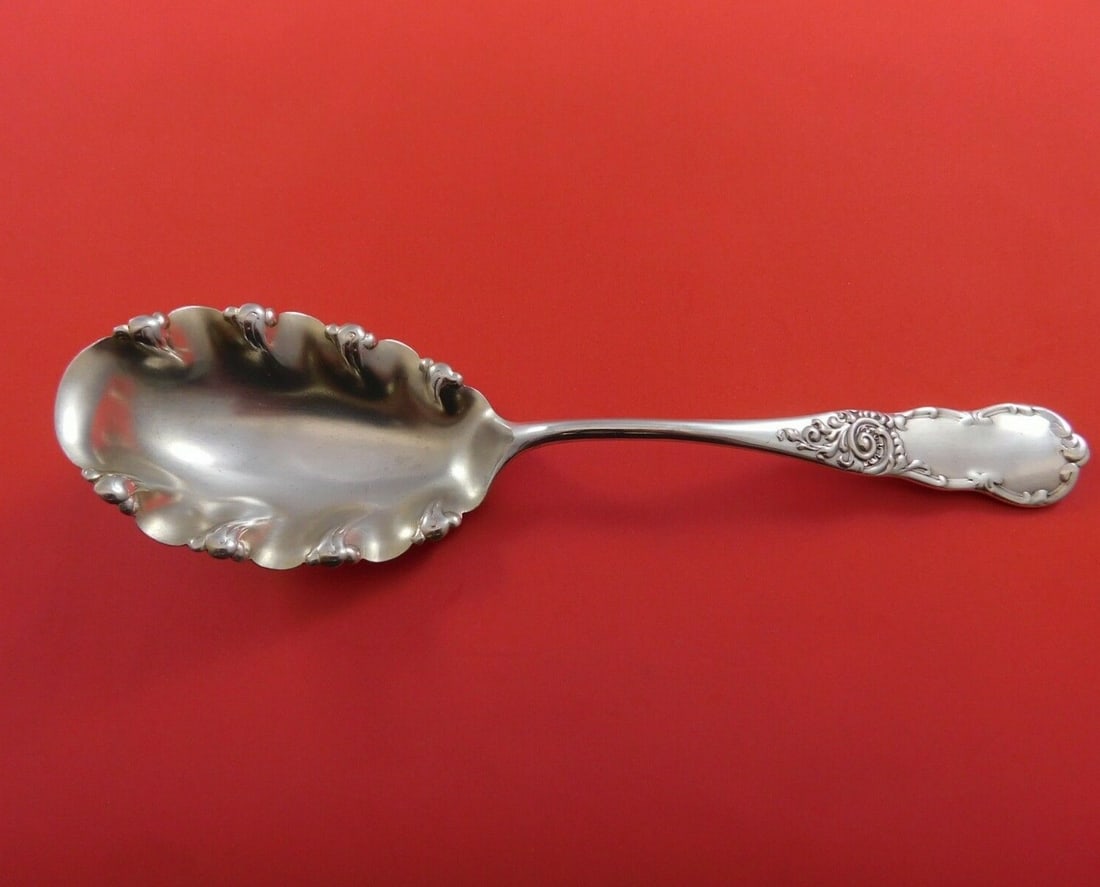 Lenox by Knowles Sterling Silver Fluted Berry Spoon 8 3/4": Lenox by Knowles Sterling Silver Fluted Berry Spoon 8 3/4" This exquisite serving spoon is a Lenox by Knowles piece, crafted from high-quality sterling silver. Its elegant fluted design and generous 8