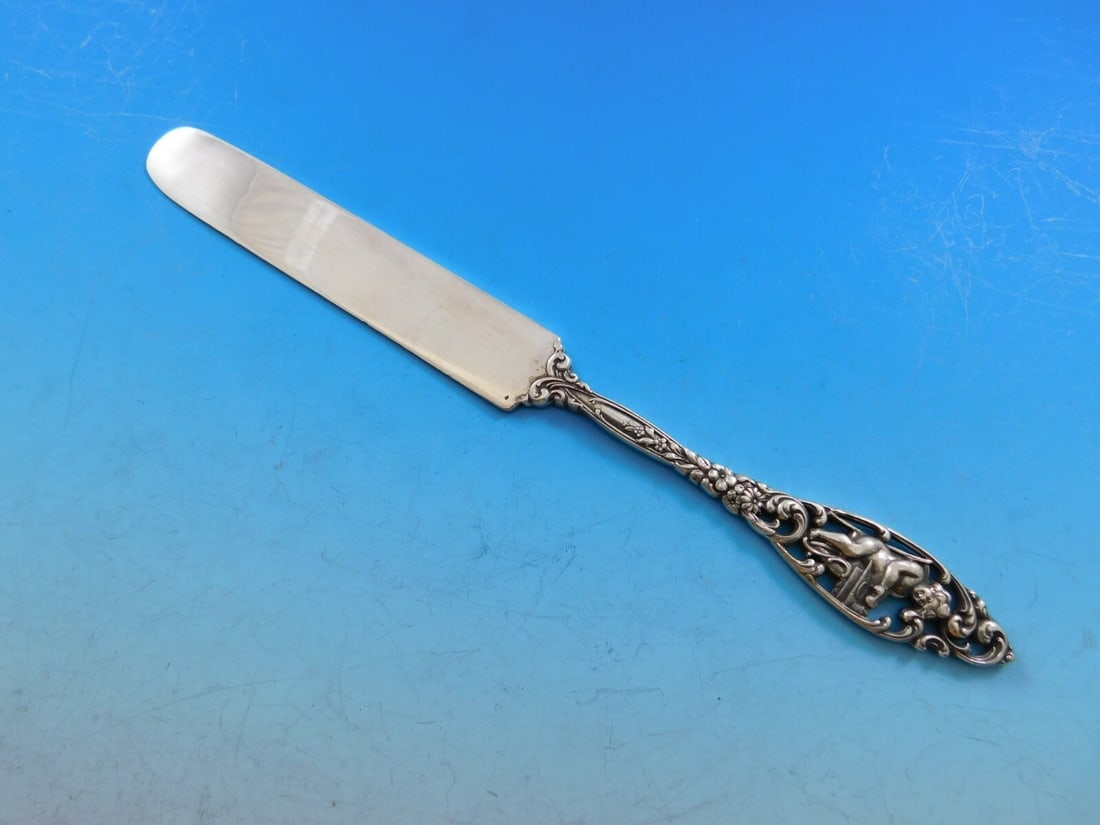 Dominick & Haff Labors of Cupid Sterling Silver Junior Knife 8 Inch: Dominick & Haff Labors of Cupid Sterling Silver Junior Knife 8 Inch This exquisite junior knife features the elegant 'Labors of Cupid' pattern by Dominick & Haff, crafted from high-quality sterling si