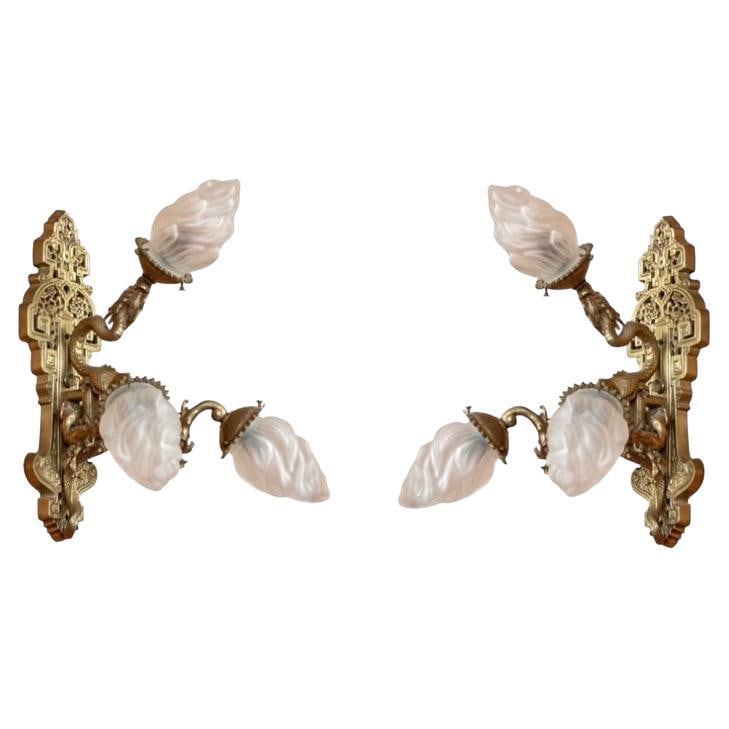 Set of 2 Early 20th Century Chinoiserie Gilt Bronze Dragon Wall Lights: Set of 2 Early 20th Century Chinoiserie Gilt Bronze Dragon Wall Lights This pair of Chinoiserie style wall sconces, dating to the early 20th century, features intricate gilt bronze construction with o