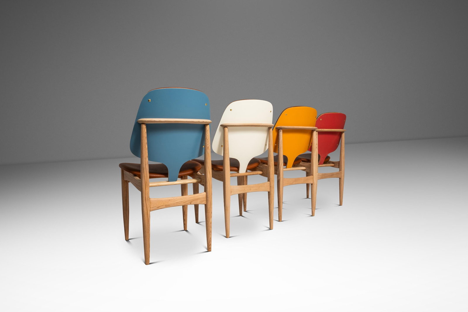 Set of 4 Elliots of Newbury Dining Chairs in Style of Arne Vodder England 1960s: Set of 4 Elliots of Newbury Dining Chairs in Style of Arne Vodder England 1960s This rare set of four Mid-Century Modern dining chairs, crafted by Elliots of Newbury in England during the 1960s, is in