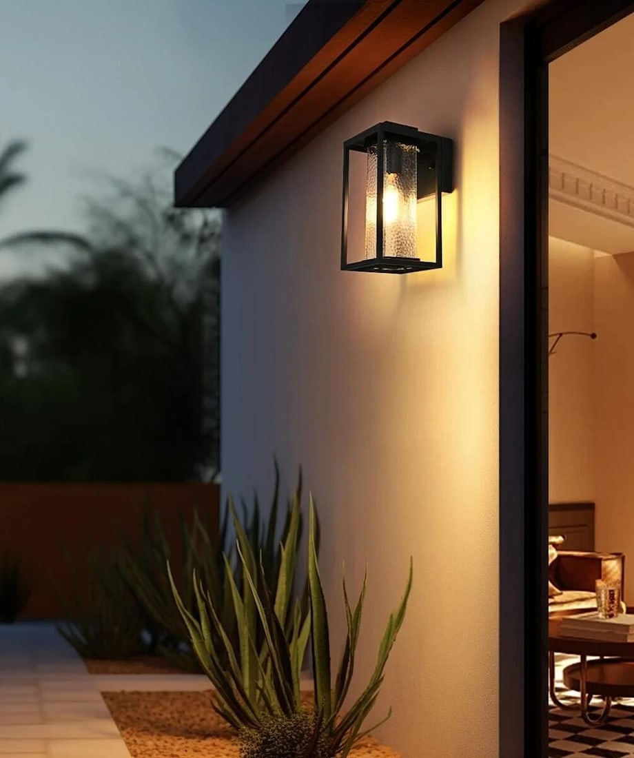 Philip Black Outdoor Wall Light With Hammered Glass Shade 11.5 Inch: Philip Black Outdoor Wall Light With Hammered Glass Shade 11.5 Inch This outdoor wall sconce features a traditional design with a hammered glass shade and a black iron finish. It is suitable for entry