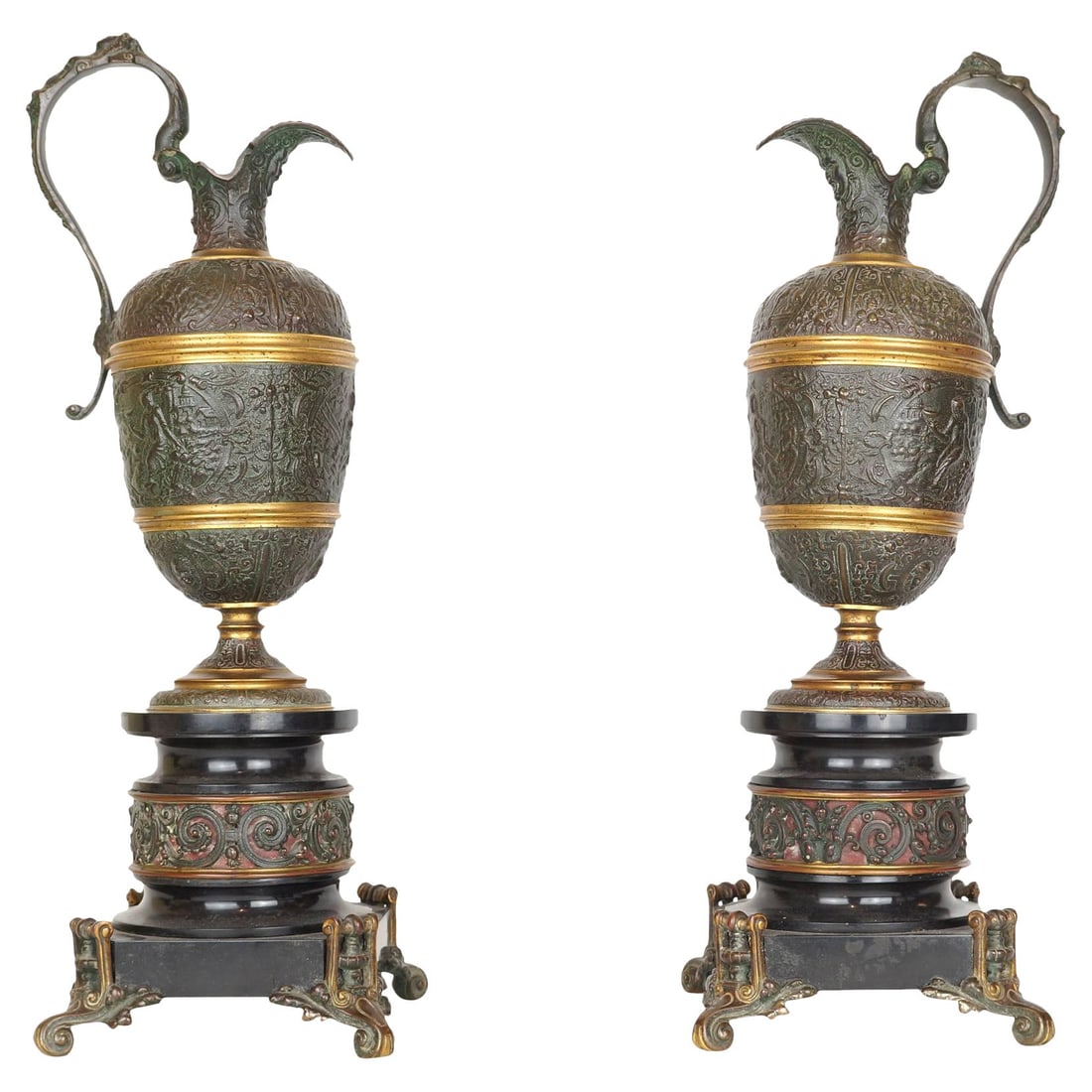 Set of 2 French Neoclassical Bronze and Marble Renaissance Revival Ewers: Set of 2 French Neoclassical Bronze and Marble Renaissance Revival Ewers This pair of 19th century neoclassical pitchers, also known as ewers, is crafted from patinated bronze with black marble accent