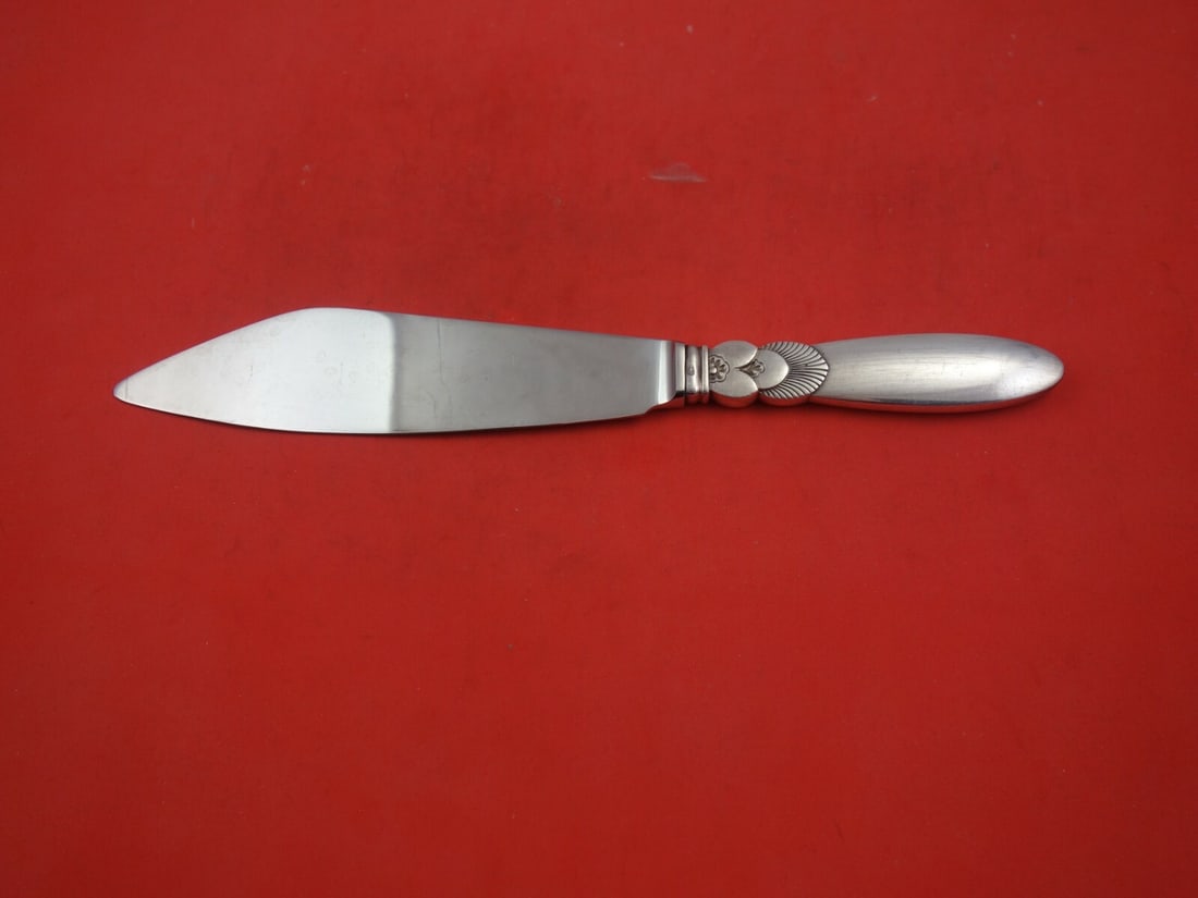 Georg Jensen Cactus Sterling Silver Cake Knife 10.5 Inch No Notch: Georg Jensen Cactus Sterling Silver Cake Knife 10.5 Inch No Notch Experience the elegance of the Cactus pattern with this exquisite cake knife crafted by Georg Jensen. Made from high-quality sterling 