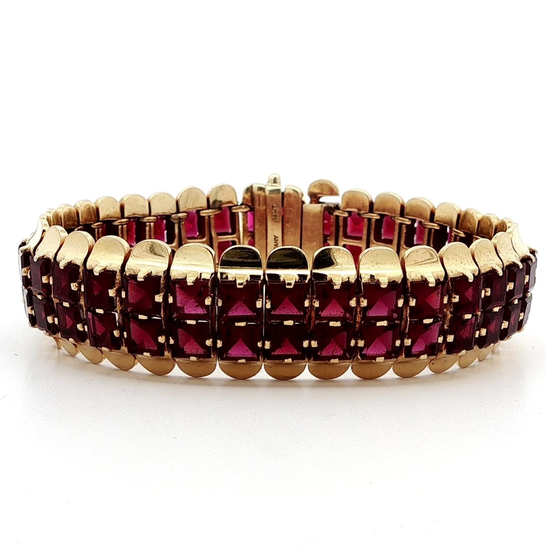 Tiffany & Co. Vintage 14k Gold Red Garnet Flared Edge Bracelet: Tiffany & Co. Vintage 14k Gold Red Garnet Flared Edge Bracelet This exquisite vintage retro bracelet from Tiffany & Co. features a stunning design with two rows of natural red garnets. Each garnet is 