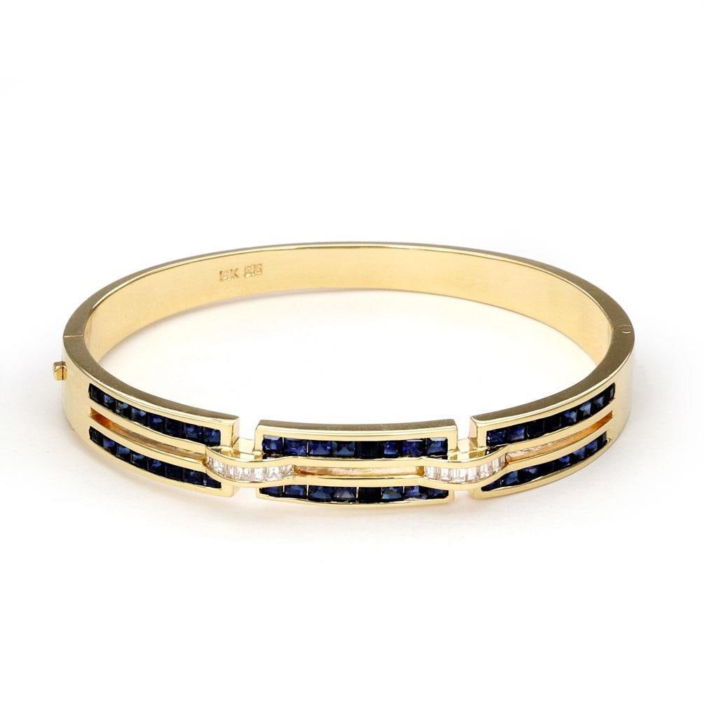 Estate 4.10ct Sapphire Diamond 14k Yellow Gold Bangle Bracelet: Estate 4.10ct Sapphire Diamond 14k Yellow Gold Bangle Bracelet This exquisite Estate bangle bracelet is meticulously crafted from 14k yellow gold, showcasing a polished finish that radiates elegance. 