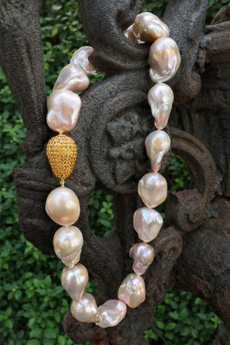 Baroque Freshwater Pearl Strand With Yellow Gold Sapphire Clasp by Yvel 17.5 Inch: Baroque Freshwater Pearl Strand With Yellow Gold Sapphire Clasp by Yvel 17.5 Inch This large baroque pearl necklace features seventeen genuine cultured freshwater pearls in baroque shapes, displaying 