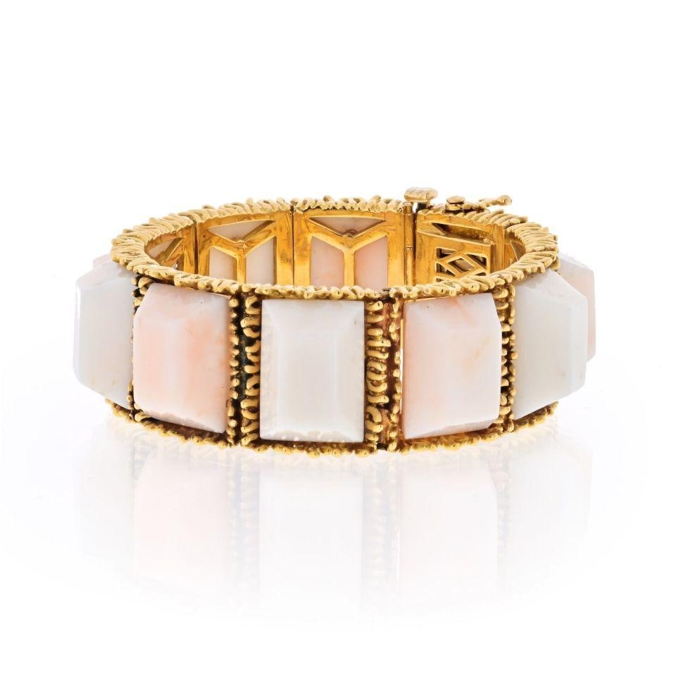 Tiffany & Co. 18K Yellow Gold Vintage Coral Semi Flex Bracelet: Tiffany & Co. 18K Yellow Gold Vintage Coral Semi Flex Bracelet This exquisite vintage bracelet from Tiffany & Co. is crafted in luxurious 18K yellow gold, weighing 95.7 grams. Designed for smaller wri