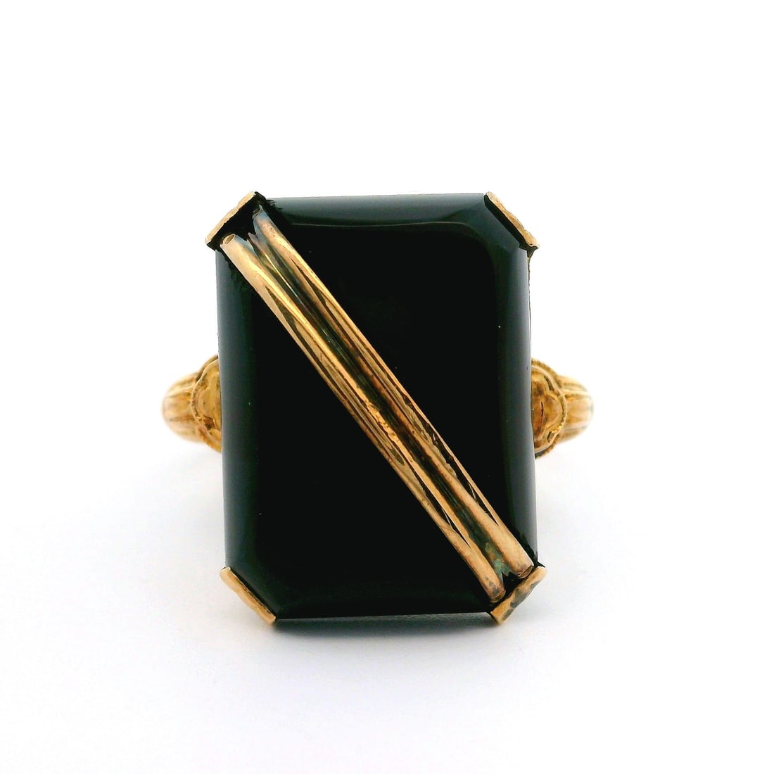 Antique 10k Yellow Gold Cushion Onyx Buckle Cocktail Ring: Antique 10k Yellow Gold Cushion Onyx Buckle Cocktail Ring This stunning antique cocktail ring features a striking cushion cut black onyx stone, elegantly set in 10k yellow gold. The ring showcases a u