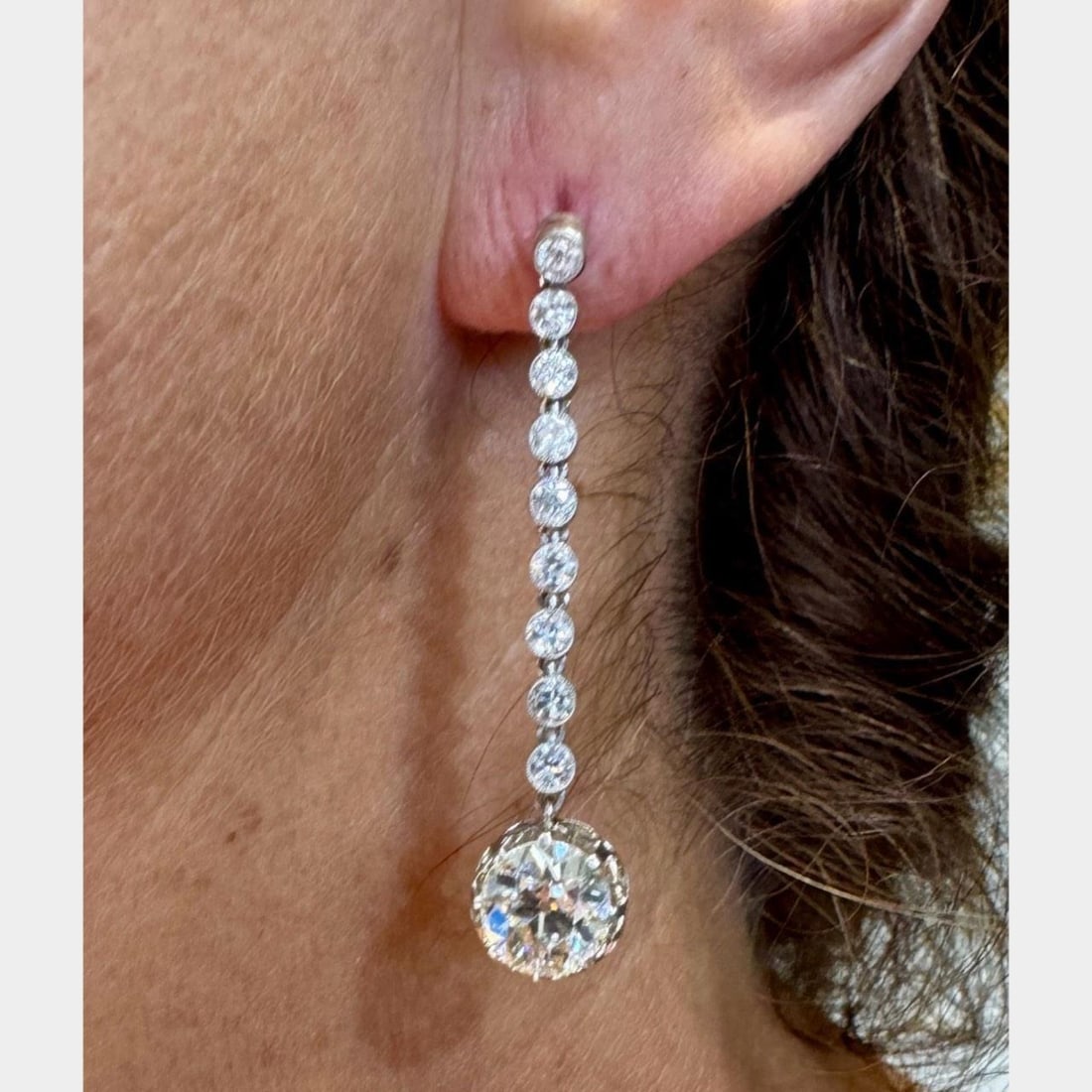 Art Deco Platinum 7.50 Ct Diamond Earrings with European-Cut Diamonds: Art Deco Platinum 7.50 Ct Diamond Earrings with European-Cut Diamonds These stunning Art Deco earrings are crafted in platinum and showcase a total diamond weight of 7.50 carats. Each earring features