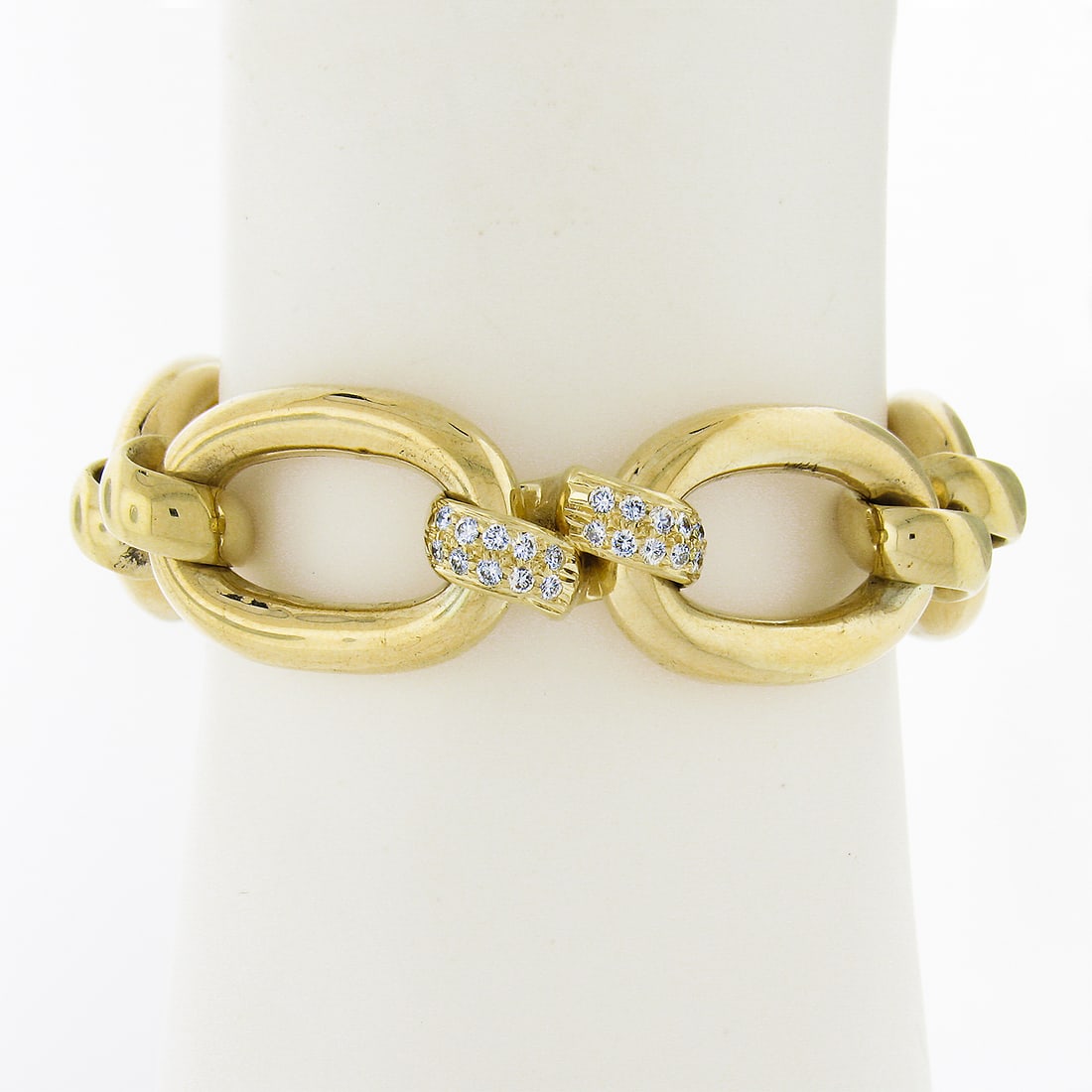 14K Yellow Gold Custom Diamond Bracelet 0.90ctw Open Oval Links: 14K Yellow Gold Custom Diamond Bracelet 0.90ctw Open Oval Links This exquisite bracelet showcases a stunning design with large open oval links crafted in solid 14K yellow gold. Featuring 60 natural ro