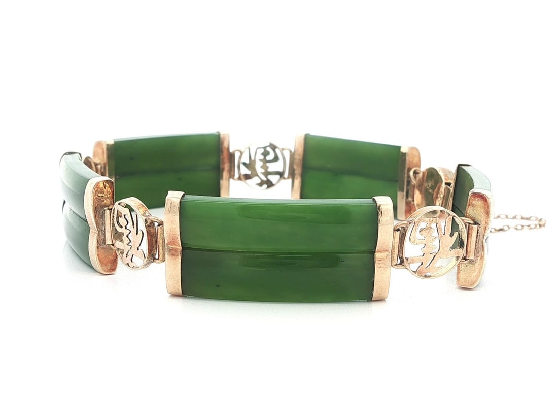 Vintage Yellow Gold Jade Bracelet with Chinese Symbol Links: Vintage Yellow Gold Jade Bracelet with Chinese Symbol Links This exquisite vintage bracelet features a stunning design of alternating links made from carved natural jade stones and Chinese symbols. Ea