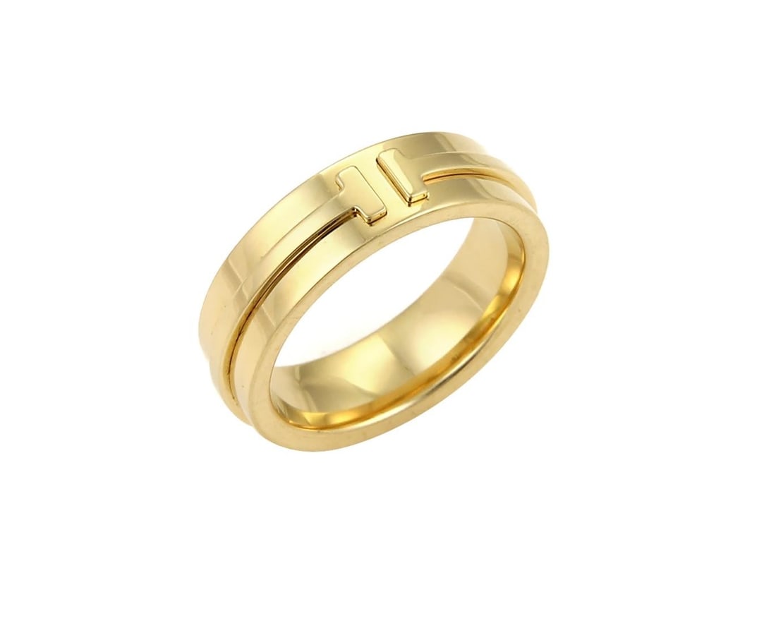 T Two Collection 18k Yellow Gold Band Ring by Tiffany Size 5.5: T Two Collection 18k Yellow Gold Band Ring by Tiffany Size 5.5 This Tiffany & Co. T Two band ring is crafted from solid 18k yellow gold and features the signature T Two motif, symbolizing connection a