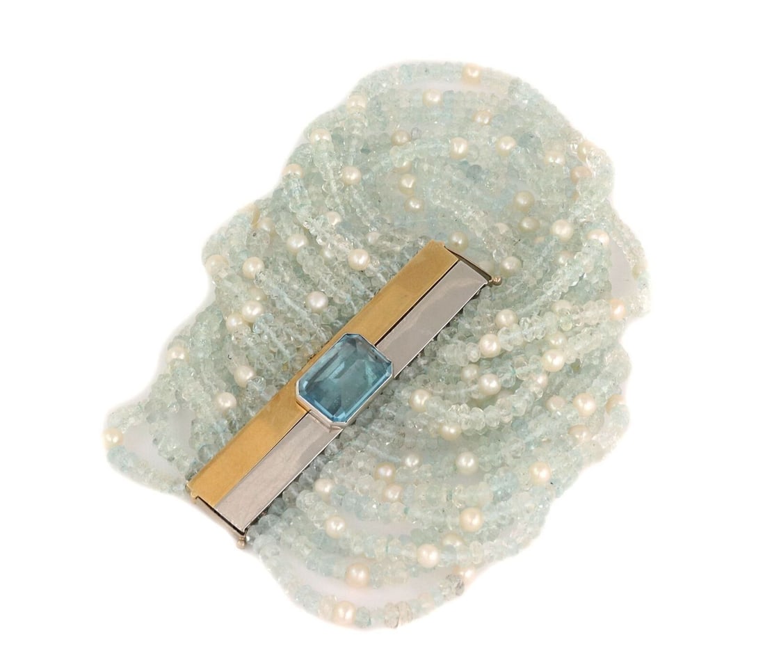 Wide Multi-Strand Bracelet with Blue Topaz Aquamarine Pearls 18k Gold: Wide Multi-Strand Bracelet with Blue Topaz Aquamarine Pearls 18k Gold This vintage bracelet showcases a wide multi-strand beaded design crafted from 18k yellow and white gold. It is elegantly adorned 