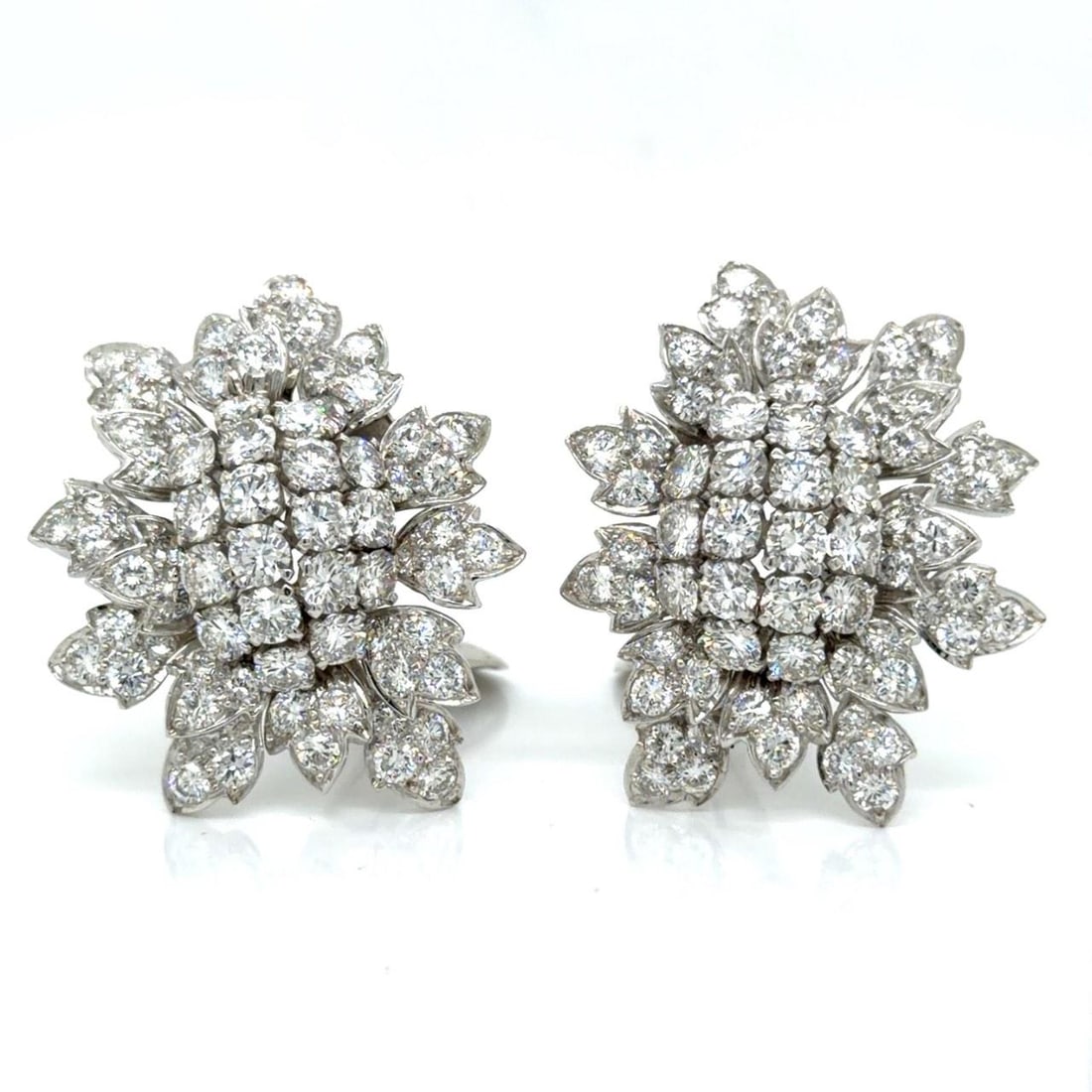 Platinum Diamond Cluster Earrings by David Webb with 10.75 Carats: Platinum Diamond Cluster Earrings by David Webb with 10.75 Carats These David Webb platinum earrings feature a striking cluster design, set with approximately 10.75 carats of 136 diamonds in F-G color