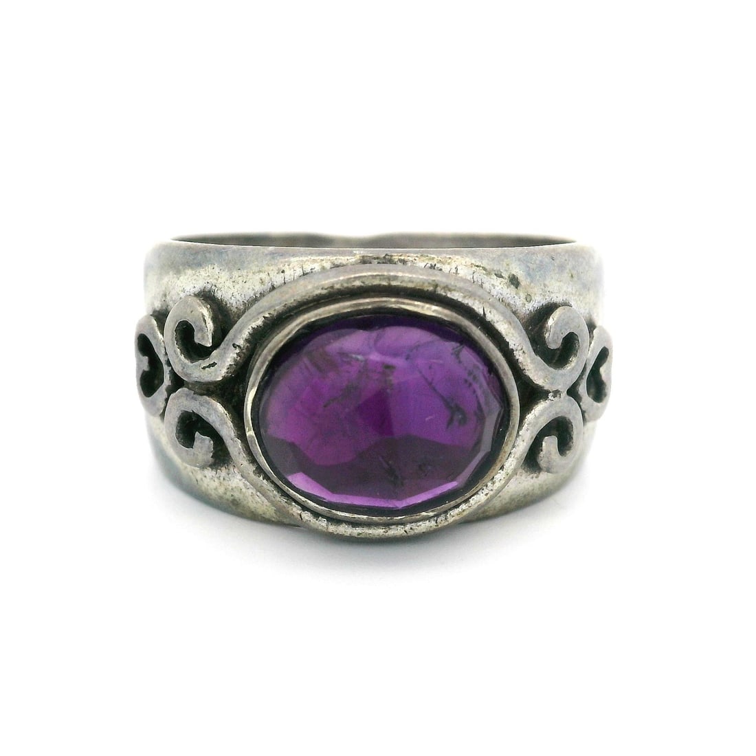 Vintage Sterling Silver Amethyst Heart Cocktail Band Ring: Vintage Sterling Silver Amethyst Heart Cocktail Band Ring This stunning vintage cocktail band ring showcases an exquisite oval amethyst at its center, beautifully complemented by intricate heart scrol