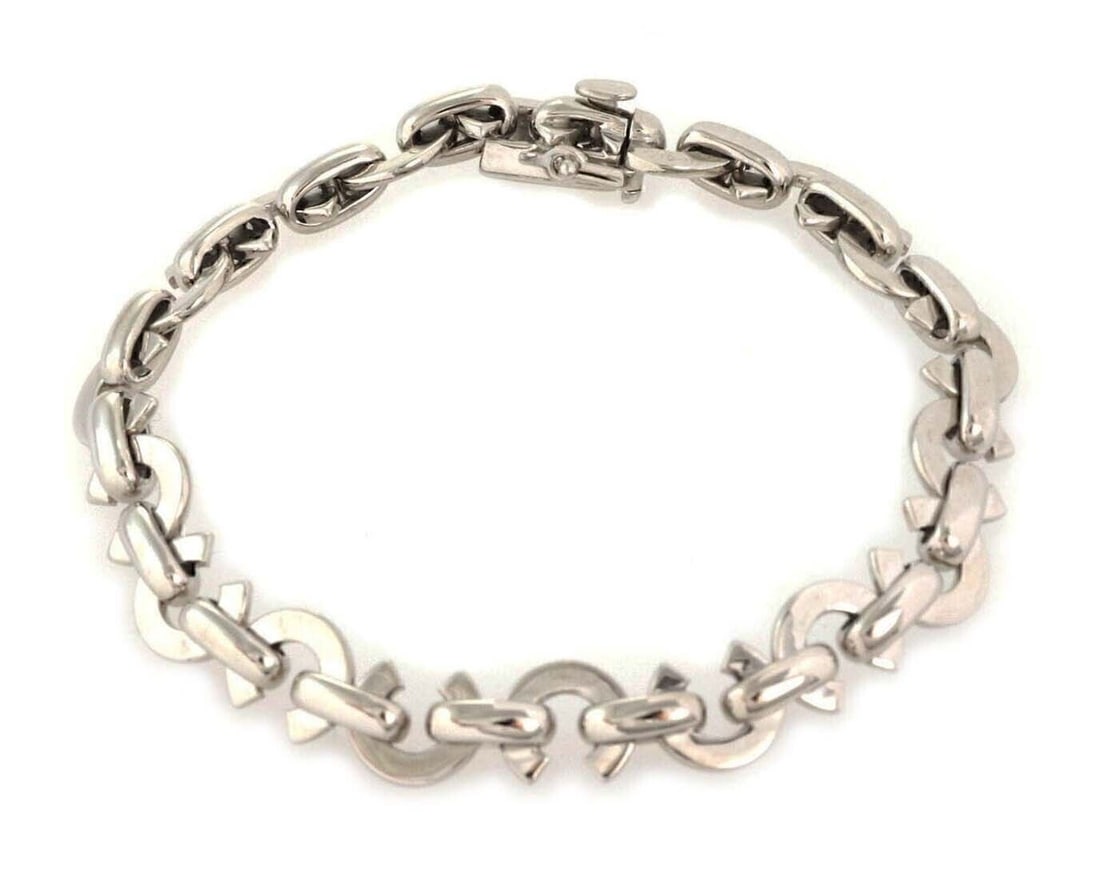 18k White Gold Link Bracelet Signed Chanel Italy: 18k White Gold Link Bracelet Signed Chanel Italy This authentic Chanel bracelet is crafted from solid 18k white gold featuring a classic link design. Polished links offer a refined and versatile style