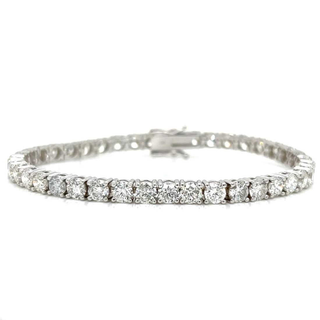 14K White Gold 13.00 Ct Diamond Tennis Bracelet 40 Stones F-G SI1-SI3: 14K White Gold 13.00 Ct Diamond Tennis Bracelet 40 Stones F-G SI1-SI3 This stunning 14K White Gold Tennis Bracelet features a remarkable total diamond weight of approximately 13.00 carats, showcasing 