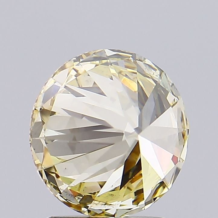 Ideal Loose Diamond - ROUND 2.01ct Fancy Yellow VS2: Ideal Loose Diamond - ROUND 2.01ct Fancy Yellow VS2 Source: This is a real non-mined Diamond that has been grown in a lab Shape: ROUND Carats: 2.01 Color: Fancy Yellow Certification: IGI Video: Video