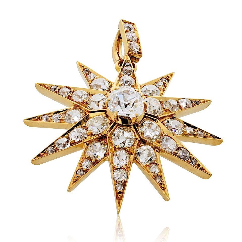 Victorian Starburst Pendant in 18K Gold with 6.33ct Old Mine Diamonds: Victorian Starburst Pendant in 18K Gold with 6.33ct Old Mine Diamonds This Victorian-era starburst pendant is crafted in 18K yellow gold and set with 46 antique diamonds. The centerpiece is an old min