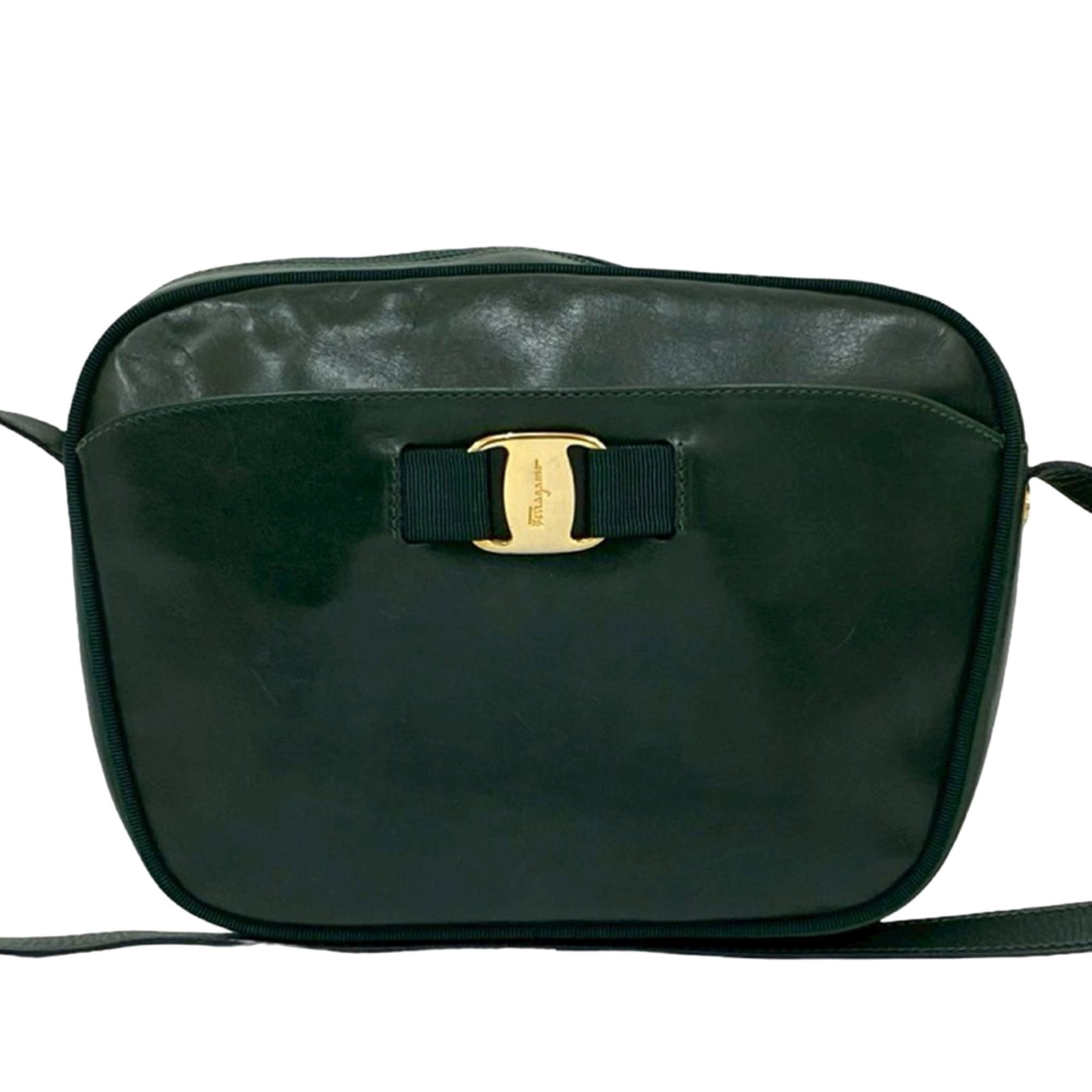 Green Leather Vara Crossbody Bag by Ferragamo with Bow Detail: Green Leather Vara Crossbody Bag by Ferragamo with Bow Detail This Ferragamo Calfskin Vara Crossbody bag features a green leather body with signature bow and canvas piping details. It is designed with