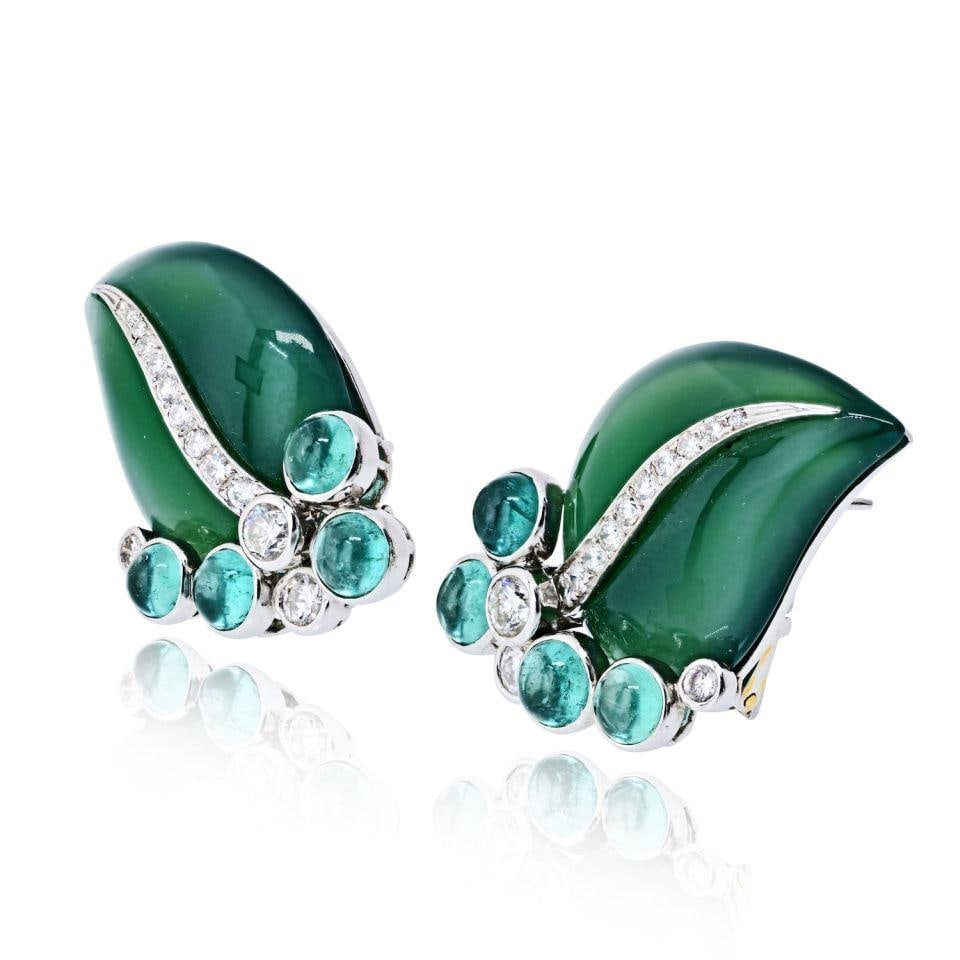 Green Onyx Leaf Earrings in 18K White Gold with Diamonds: Green Onyx Leaf Earrings in 18K White Gold with Diamonds Elegant earrings crafted from 18K white gold, featuring green onyx and diamond leaf motifs. These pre-owned earrings combine luxurious material