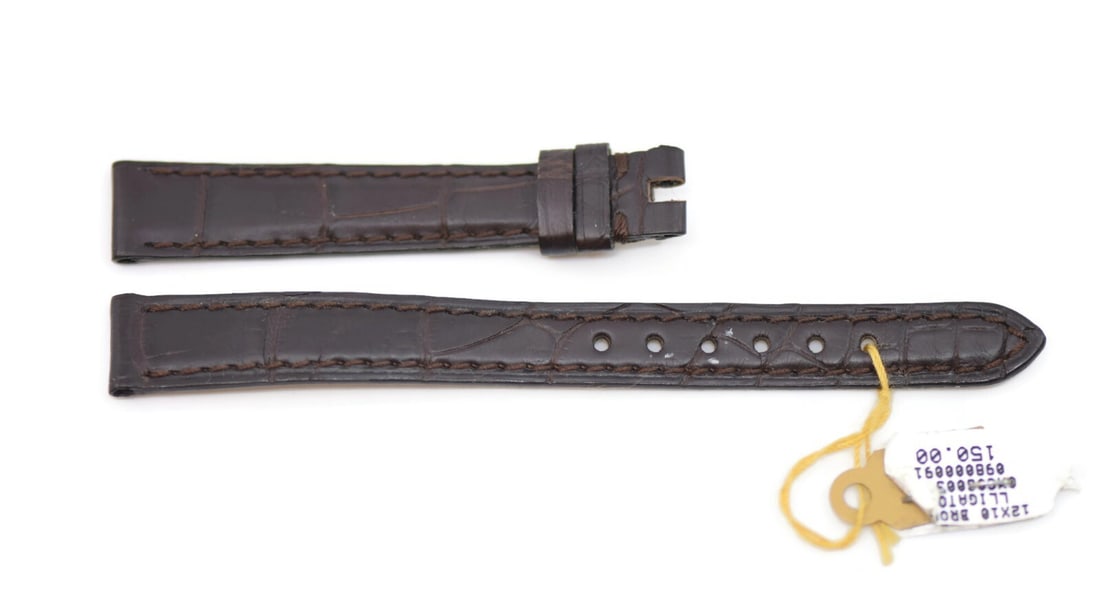 Authentic Omega Brown Leather Wristwatch Band 12mm: Authentic Omega Brown Leather Wristwatch Band 12mm Enhance your timepiece with this authentic Omega Brown Leather Strap. Designed specifically for wristwatches, this strap features a sleek brown leath