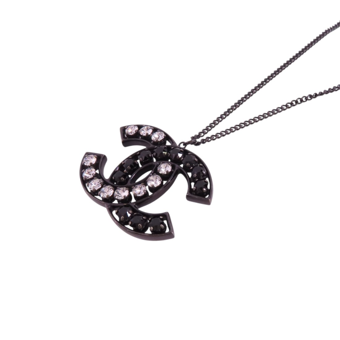 CHANEL CC Black Necklace with Rhinestone Accents: CHANEL CC Black Necklace with Rhinestone Accents Elevate your accessory game with this exquisite CHANEL CC Necklace. Crafted in France, this necklace features a sleek black design with rhinestone embe