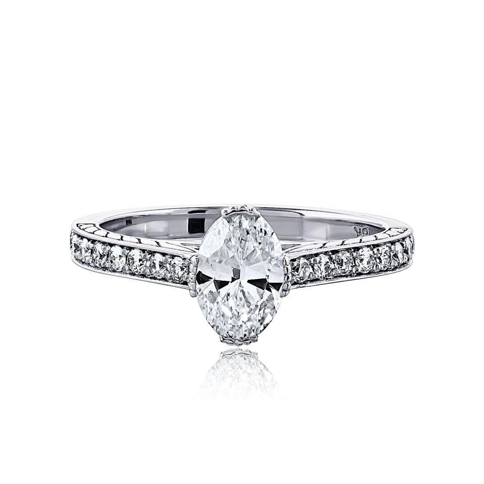 GIA Certified 0.90ct Oval Diamond Engagement Ring in 18K White Gold Size 6.5: GIA Certified 0.90ct Oval Diamond Engagement Ring in 18K White Gold Size 6.5 This elegant ring features a 0.90 carat oval diamond with F color and SI1 clarity, set in 18K white gold. The ring has a to