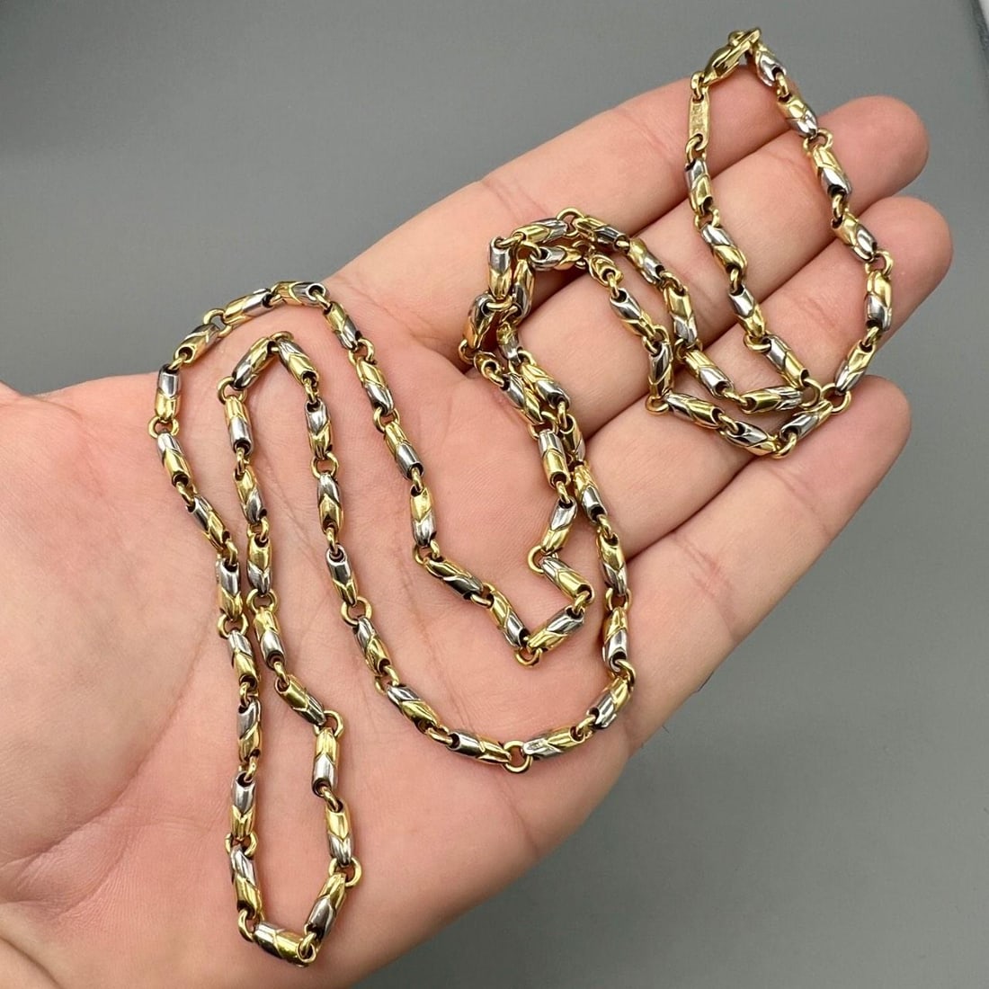 18K Yellow Gold and Steel Long Necklace by BVLGARI 30 Inch: 18K Yellow Gold and Steel Long Necklace by BVLGARI 30 Inch This BVLGARI necklace is crafted from 18K yellow gold and stainless steel. It weighs 45.9 grams and measures 30 inches in length. The necklac