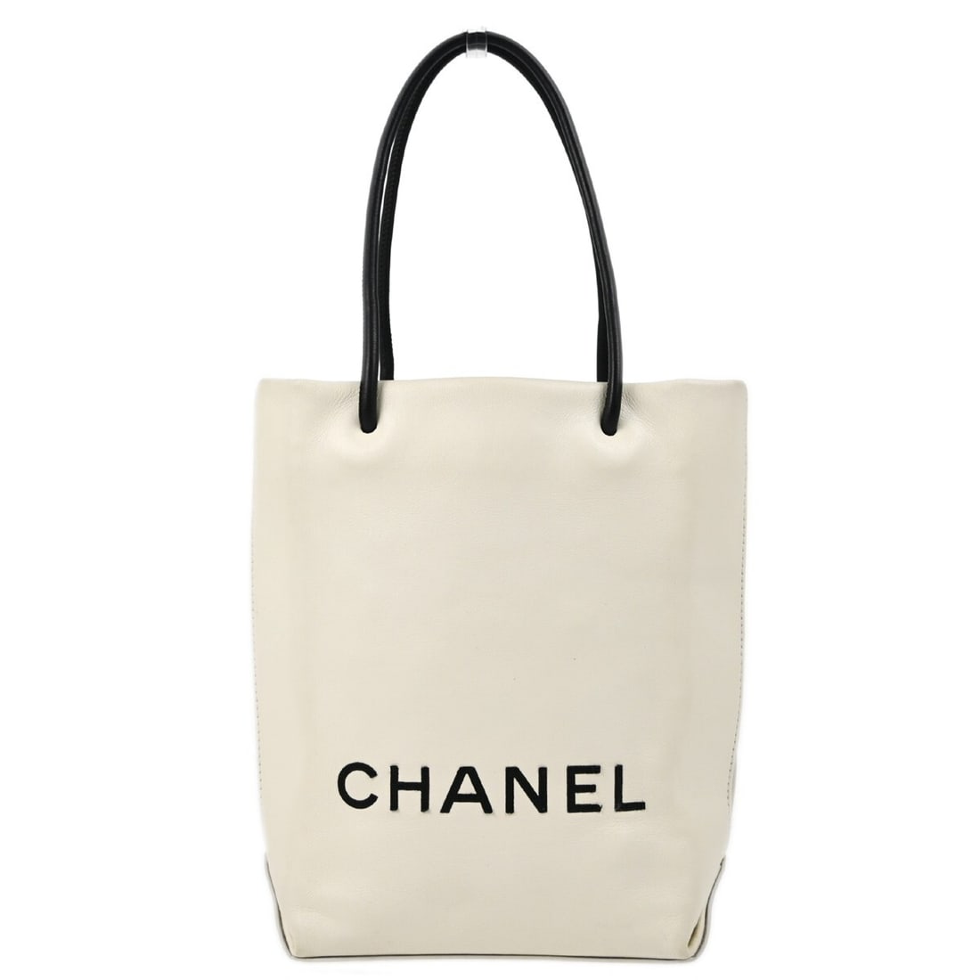 Small White Calfskin Essential Tote by Chanel with Double Handles: Small White Calfskin Essential Tote by Chanel with Double Handles This Chanel Essential Tote bag is crafted from white calfskin leather and features double handles with a 5-inch drop. The small-sized 