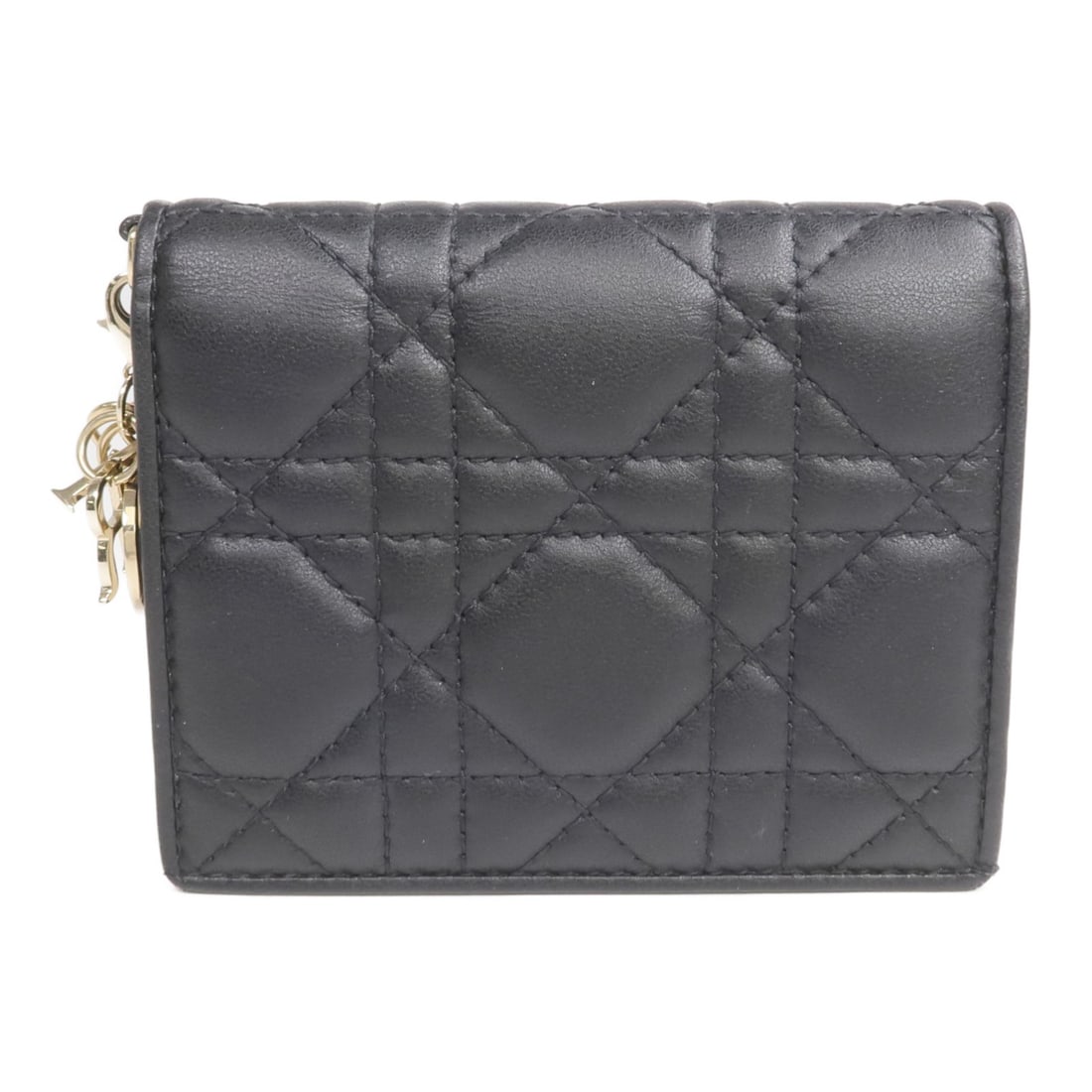 Dior Lady Dior Mini Gardenia Black Lambskin Bi-Fold Wallet GHW: Dior Lady Dior Mini Gardenia Black Lambskin Bi-Fold Wallet GHW This Christian Dior mini Lady Dior Gardenia bi-fold wallet is crafted from luxurious black lambskin leather. Designed for women, it featu