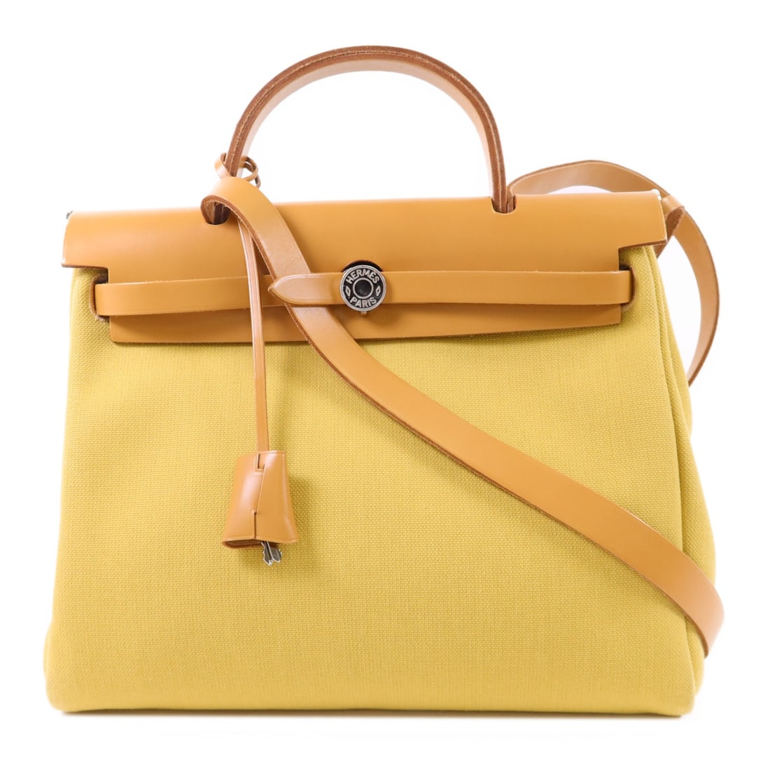Herbag PM Yellow Canvas Shoulder Bag with Palladium Hardware by Hermes: Herbag PM Yellow Canvas Shoulder Bag with Palladium Hardware by Hermes This Hermes Herbag PM is a versatile 2-way shoulder handbag crafted from yellow canvas. Designed for women, it features both shou
