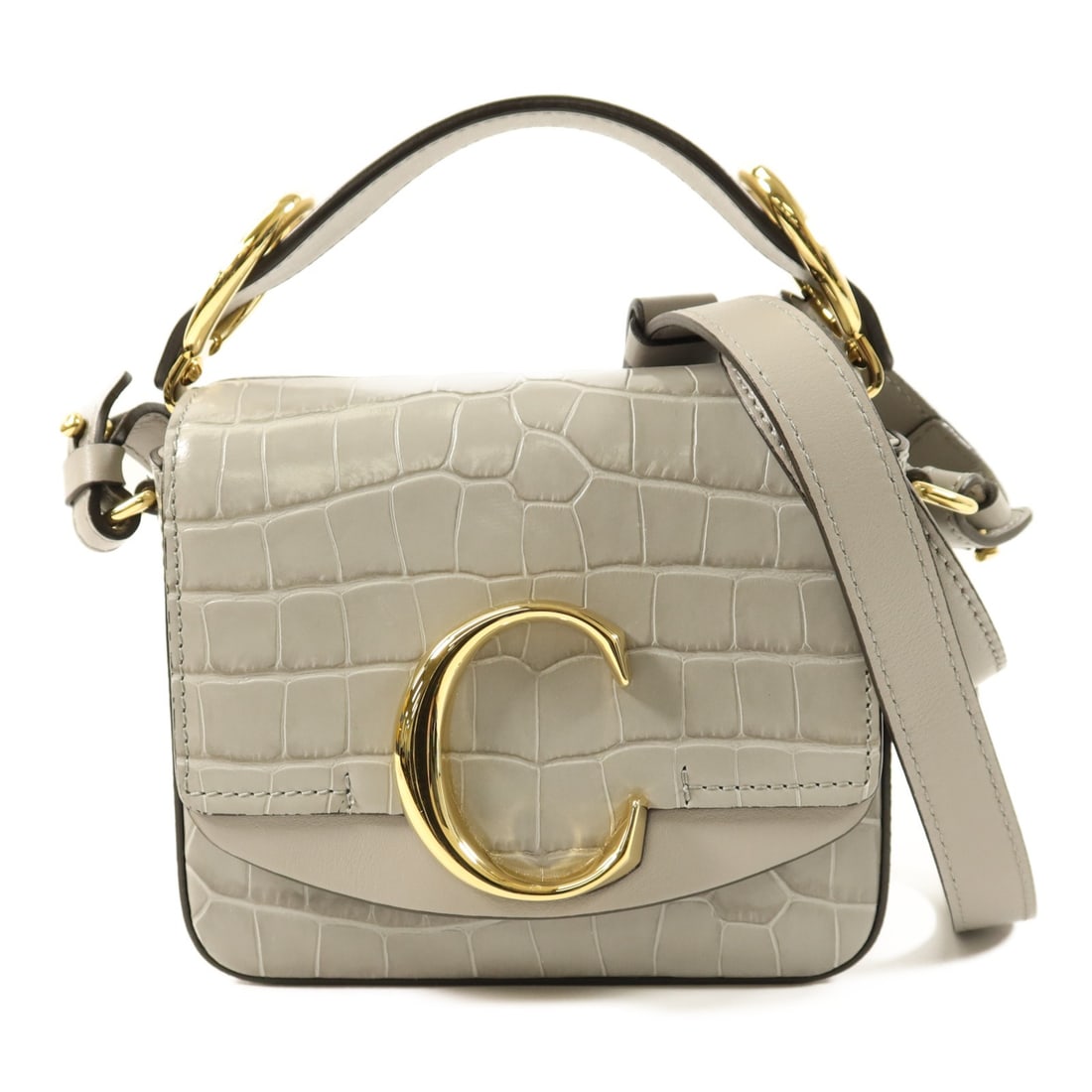 Chloe Mini C Calfskin Grey Shoulder Bag with Gold Hardware: Chloe Mini C Calfskin Grey Shoulder Bag with Gold Hardware This Chloe Mini C Bag is crafted from gray calfskin leather and offers versatile 2-way styling as a shoulder bag. It features gold tone hardw