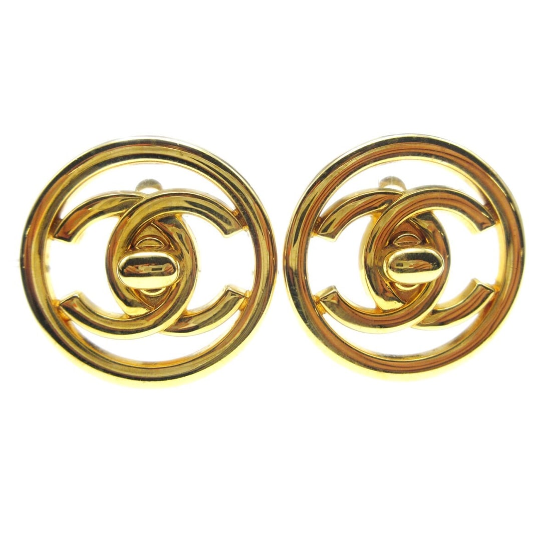 Chanel 97P Gold-Plated Turnlock Clip-On Round Earrings: Chanel 97P Gold-Plated Turnlock Clip-On Round Earrings Elevate your accessory collection with these exquisite Chanel Turnlock Round Clip-On Earrings, featuring a classic button shape that embodies ele