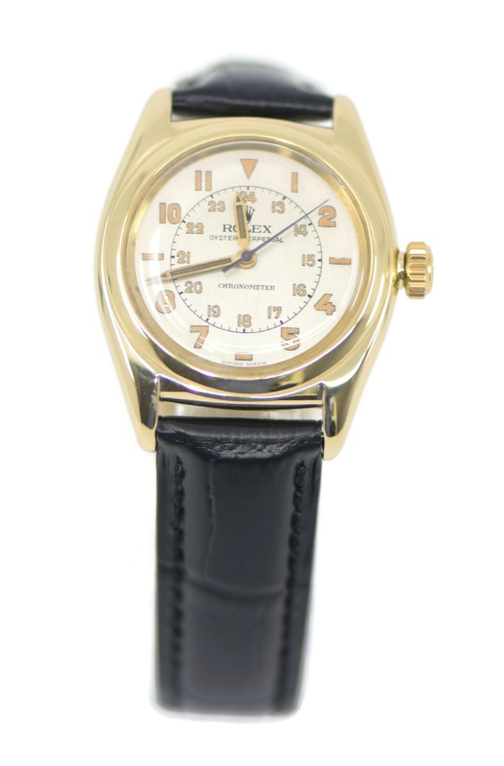 Rolex Bubbleback 14K Yellow Gold Automatic Watch Ref 3131: Rolex Bubbleback 14K Yellow Gold Automatic Watch Ref 3131 This exquisite Rolex Bubbleback wristwatch is crafted from 14K yellow gold, showcasing a refined and elegant design. The watch features a mech
