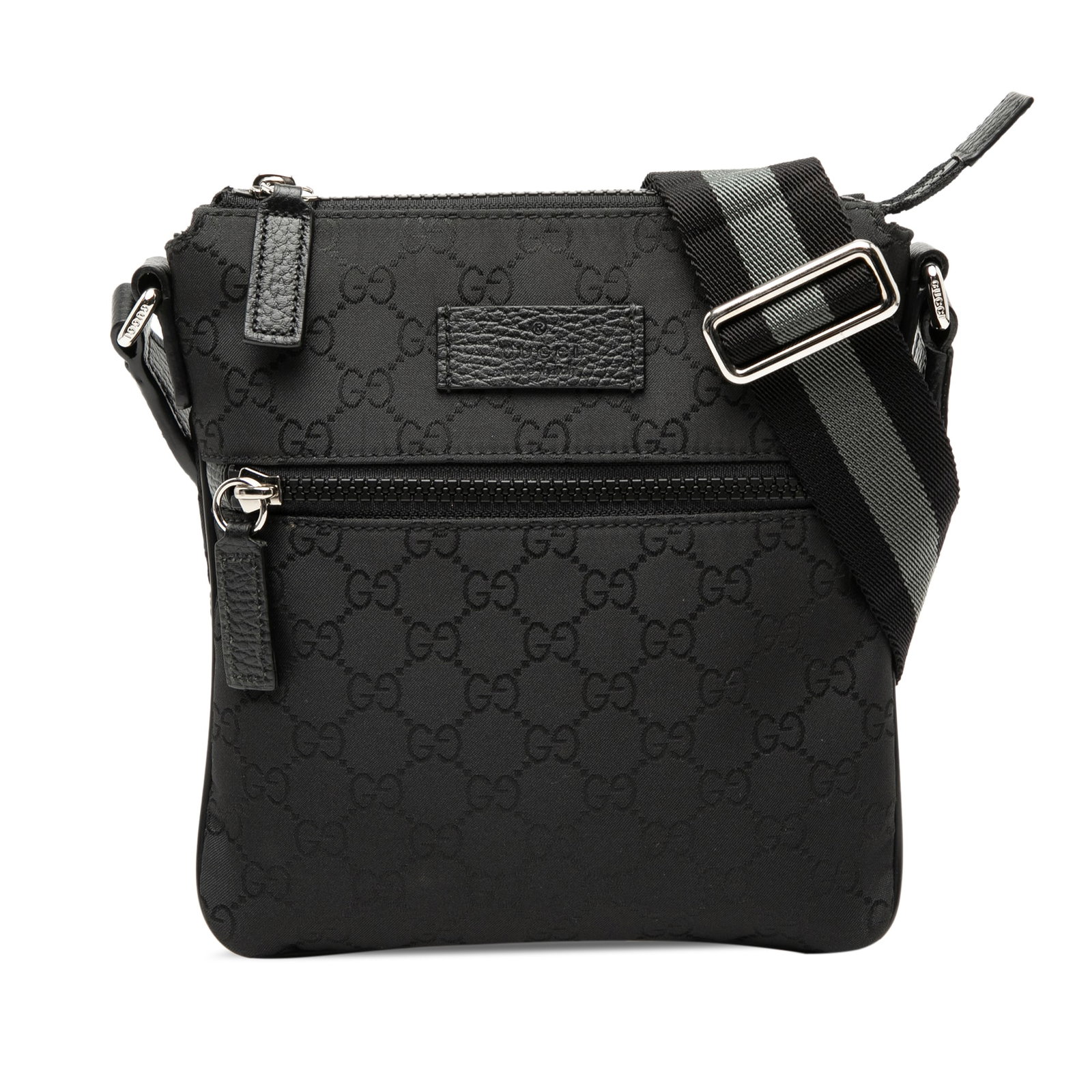 GG Nylon Web Crossbody Bag by Gucci in Black Fabric: GG Nylon Web Crossbody Bag by Gucci in Black Fabric This Gucci GG Nylon Web Crossbody bag features a black nylon body with an adjustable flat strap, a top zip closure, an exterior front zip pocket, an