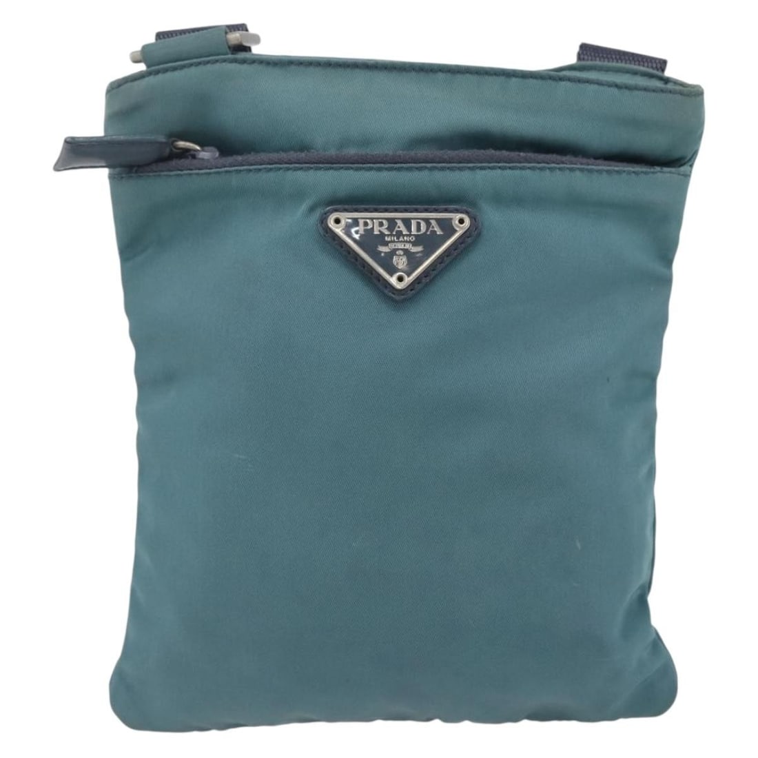 Blue Nylon Prada Shoulder Bag Vintage Unisex 17cm by 19cm by 1cm: Blue Nylon Prada Shoulder Bag Vintage Unisex 17cm by 19cm by 1cm This vintage Prada shoulder bag features a blue nylon body with leather accents and metal hardware. Designed for unisex use, it measure