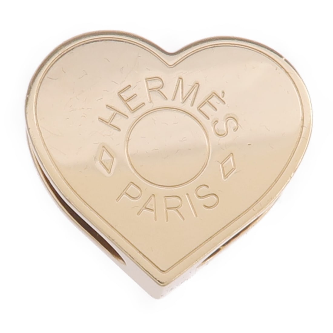 Gold Tone Scarf Ring Accessory by Hermes France: Gold Tone Scarf Ring Accessory by Hermes France This Hermes scarf ring features a gold-tone metal design, offering a stylish and functional accessory for women's scarves. Made in France, it is crafted