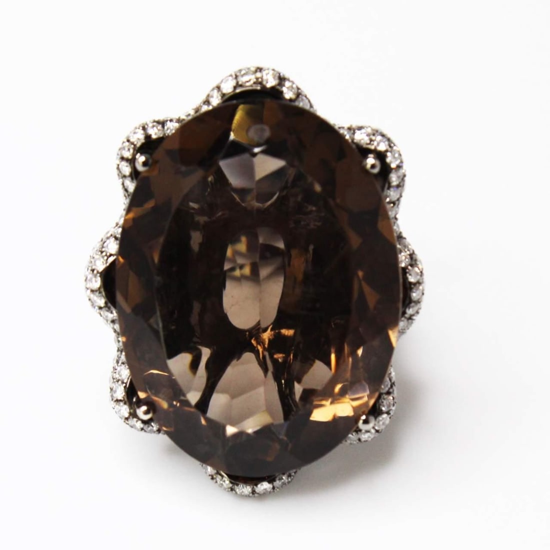 50 Ct Smokey Topaz Ring with 222 Diamonds in 18K Black Gold: 50 Ct Smokey Topaz Ring with 222 Diamonds in 18K Black Gold This stunning piece features a remarkable 50.00 ct Smokey Topaz, beautifully complemented by 222 sparkling diamonds totaling 4.50 cts. The s