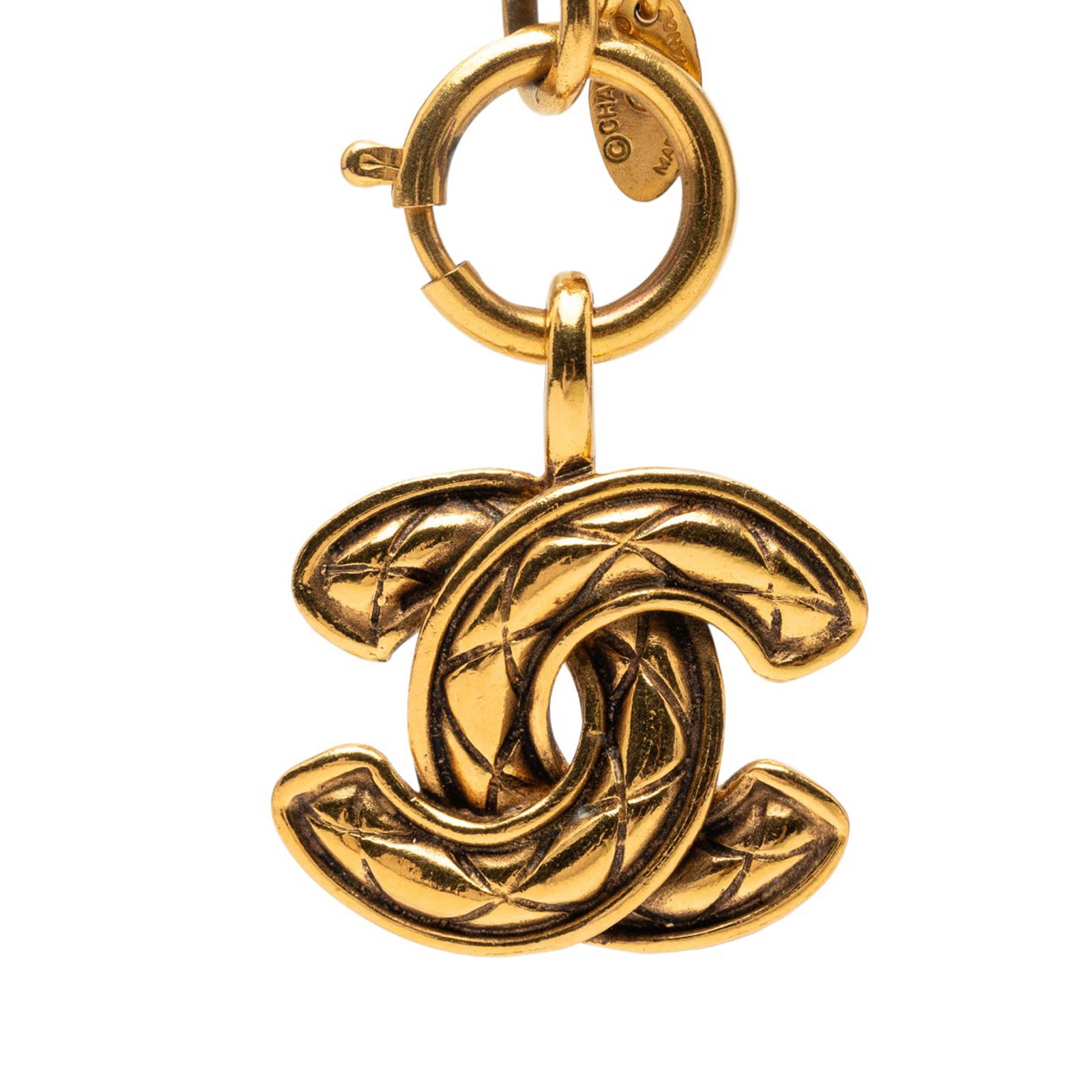 Chanel Quilted CC Logo Pendant Necklace with Gold Plated Chain: Chanel Quilted CC Logo Pendant Necklace with Gold Plated Chain This Chanel pendant necklace features a gold-plated metal chain and a signature quilted CC pendant. It is secured with a spring ring clos