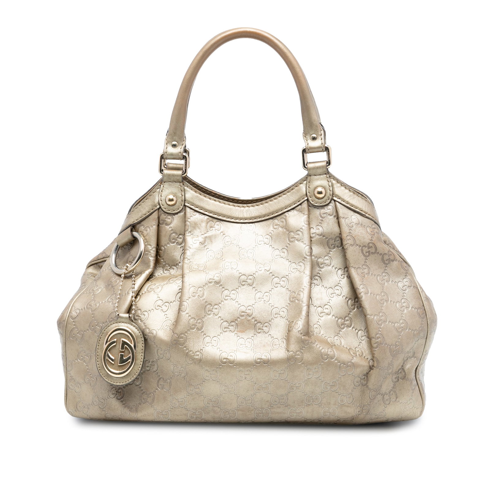 Gucci Sukey Tote Bag in Gold Guccissima Embossed Leather: Gucci Sukey Tote Bag in Gold Guccissima Embossed Leather The Medium Guccissima Sukey Tote features an embossed leather exterior with rolled leather handles, an open top secured by a button clasp, and 