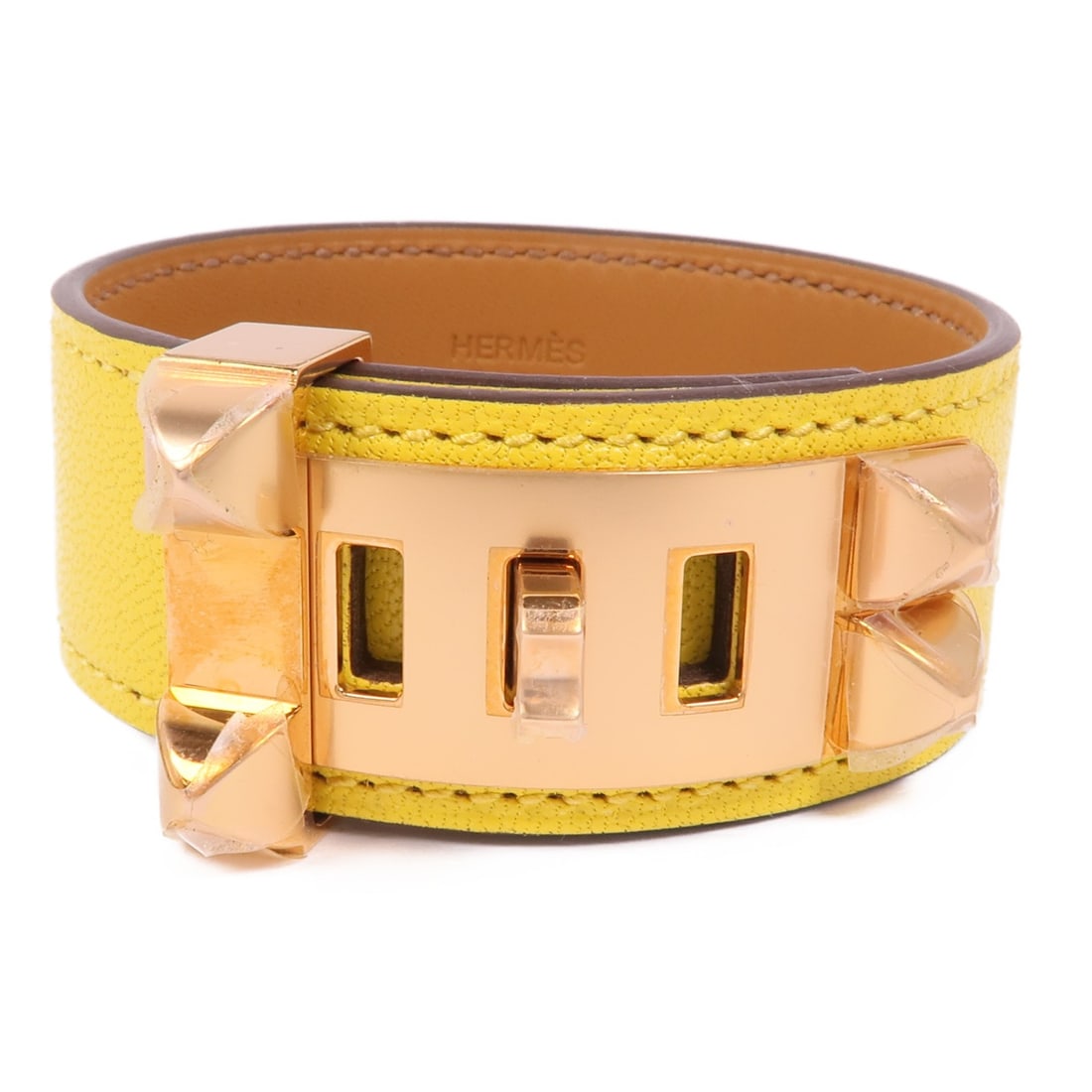HERMES Collier de Chien Bracelet Yellow Veau Swift Leather GHW: HERMES Collier de Chien Bracelet Yellow Veau Swift Leather GHW This exquisite HERMES Collier de Chien Bracelet is crafted from premium yellow calfskin leather, showcasing a luxurious and vibrant hue. 