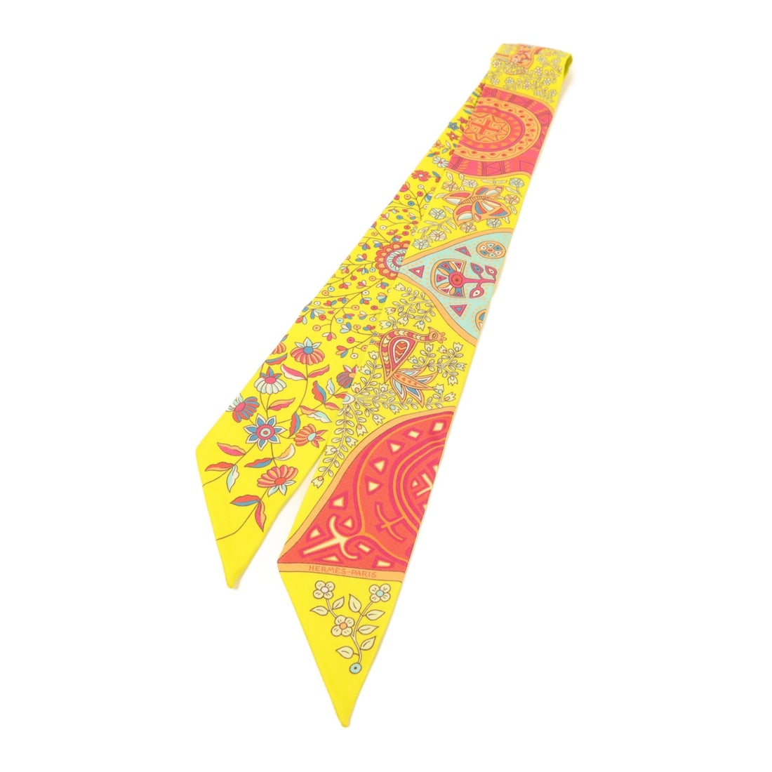 Hermes Silk Twilly Scarf in Multicolor Yellow Pink Orange for Women: Hermes Silk Twilly Scarf in Multicolor Yellow Pink Orange for Women This HERMES Twilly scarf showcases a vibrant blend of yellow, pink, orange, and multicolor accents, crafted from luxurious silk. Des