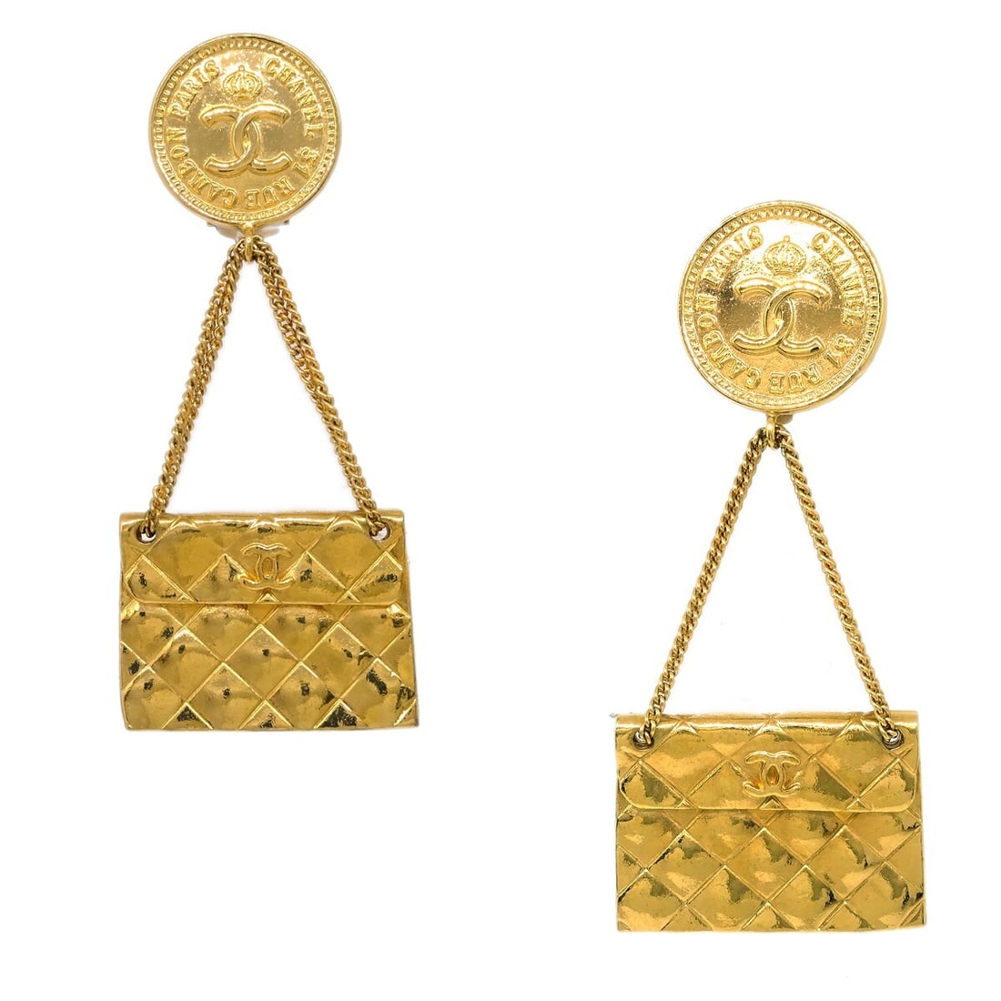 Chanel Clip-On Gold-Plated Square Button Earrings 28: Chanel Clip-On Gold-Plated Square Button Earrings 28 Elevate your accessory collection with these stunning Chanel Gold Bag Dangle Earrings. These earrings feature a fashionable square shape with a cla