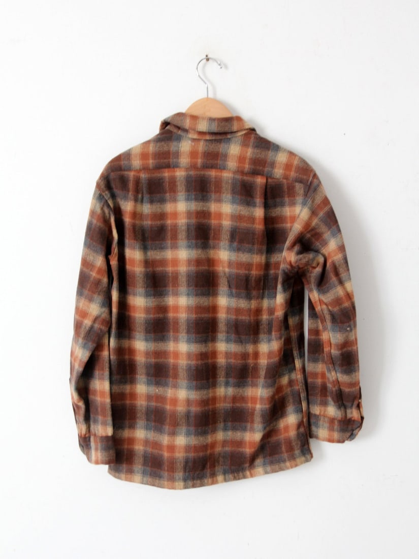 Vintage 1960s Pendleton Wool Plaid Shirt in Earthy Tones: Vintage 1960s Pendleton Wool Plaid Shirt in Earthy Tones Discover this vintage 1960's Pendleton wool button-down shirt featuring a rich plaid pattern in earthy tones of rust, charcoal grey, and beige.